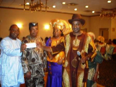 Mr. Noel Okosa recieves check for Uke education project